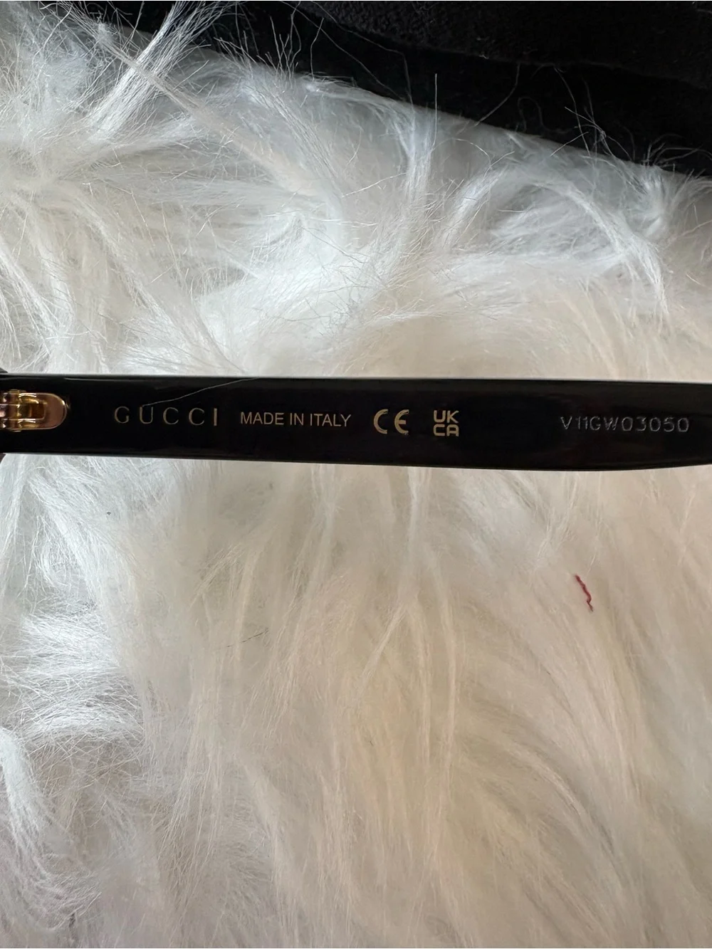Gucci Black Frame Sunglasses with Gold Logo Detailing